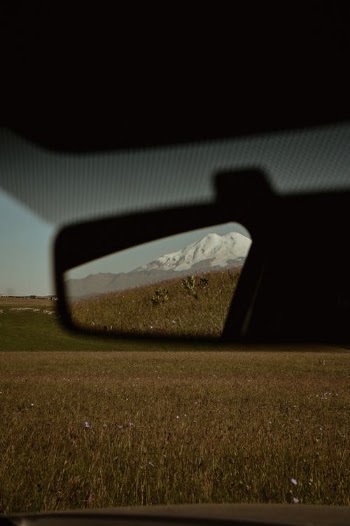 View of the Mountains in the Rear View Mirror · Free Stock Photo