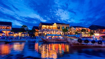 Village Near Body of Water Photo during Nighttime