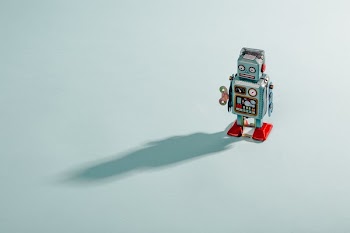 Vintage Blue Robot With A Shadow