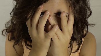 Vintage girl sad cheerless CU LT. A really sad and cheerless young ...