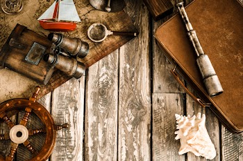 Vintage nautical things on wood background. Grunge retro toned image...