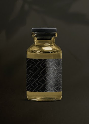 Vitamin injection glass bottle with luxurious black label for health and wellness product packaging