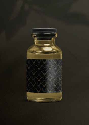 Vitamin injection glass bottle with luxurious black label for health and wellness product packaging
