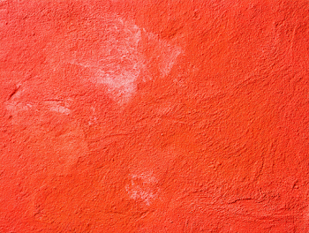 Vivid Red-Orange Stucco Wall Texture