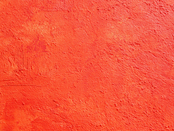 Vivid Red-Orange Stucco Wall Texture
