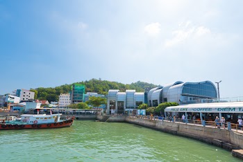 VUNGTAU, VIETNAM - JANUARY 15, 2015: Unidentified people walk at the pier by the Vungtau ferry station. Vungtau is a popular sea resort in southern Vietnam.