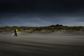 Walking on the dark beach