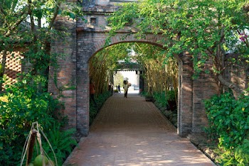 Walkway With Arched Brick Wall