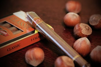 Walnut and Chocolate Stick on Wooden Surface