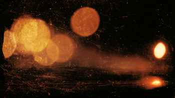 Warm Amber and Gold Bokeh Lights on Black