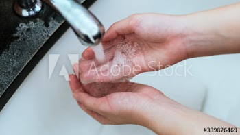 Washing hands under running water to prevent coronavirus contamination