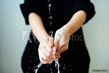 Washing hands under running water to prevent coronavirus contamination