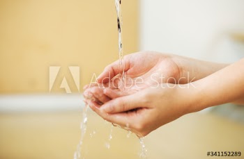 Washing hands under running water to prevent coronavirus contamination