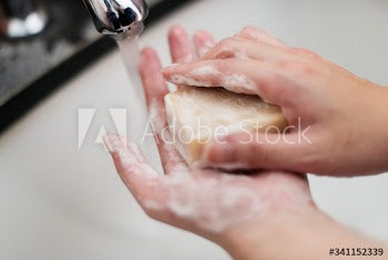 Washing hands with a bar soap to prevent coronavirus contamination