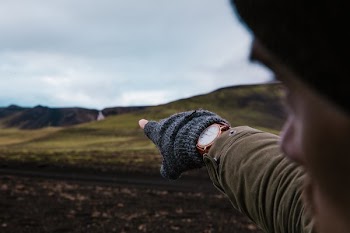 Watch And Gloves On Hand Pointing