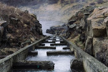 water dam between gray rock formation