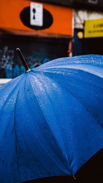 water droplets on blue umbrella