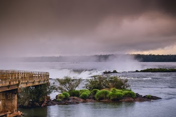 Water Falls Near Bridge Under White Cloudy Sky