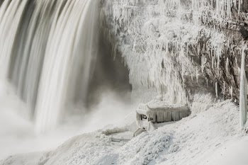 Water Falls Over Icey Rockface