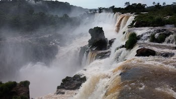 Water Falls Under White Clouds and Blue Sky during Daytime