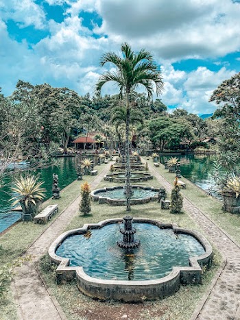 Water Fountains Beside Ponds during Day