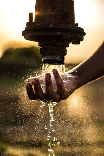 Water Pouring on Pipe