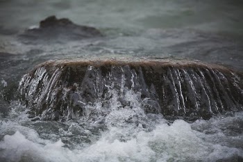 Water Washes Over Stone
