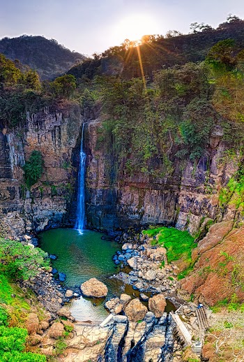 Waterfall and Rocky Mountain