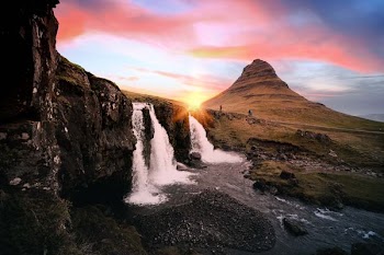 waterfalls between rock formation at golden hour