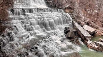 Waterfalls Flowing on Brown Rock Formation Towards River