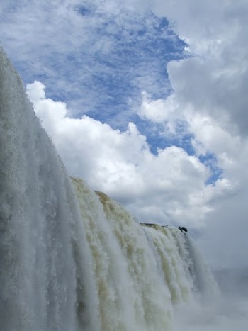 Waterfalls Under Blue Sky With White Clouds during Daytime