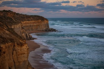 Waves break along the shores of the Great Ocean Road in Australia. 