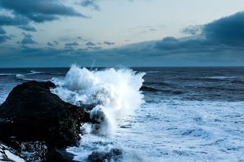 Waves Crash On Iceland Rocky Shore