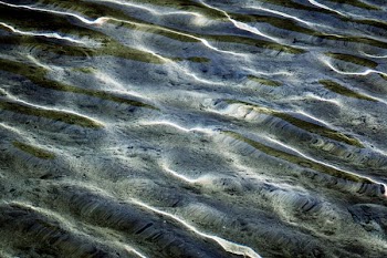 wavy body of water in closeup photography