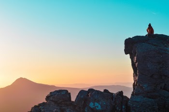 We were up at 3:30am on the day that the clocks went forward to summit the Cobbler and catch the first light of the summer. We made it to the top by 6:30am to catch the sunrise then once we had taken a few shots my friend climbed on top of the Needle (a rocky protrusion on the Cobbler) and looked out towards Ben Lomond. Without a cloud in the sky the light was perfect.