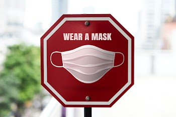 Wear a mask street sign board