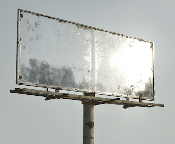 Weathered Roadside Town Signage
