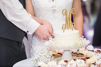 Wedding Couple Slicing Cake