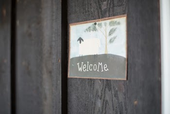 Welcome Poster on Gray Wall
