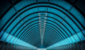 well lighted empty tunnel