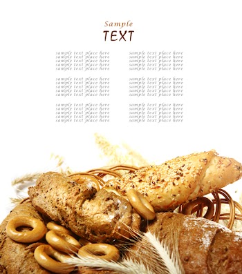 Wheat and bread over white background