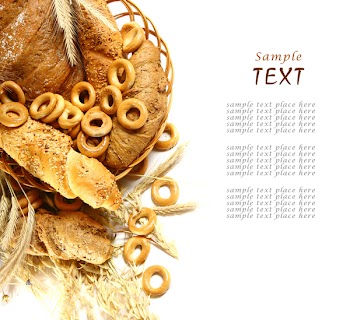 Wheat and bread over white background