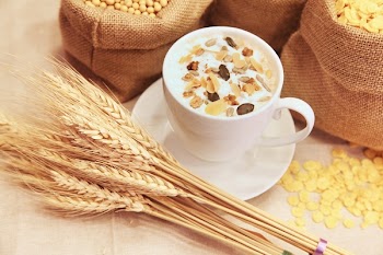 Wheat and Cup of Cereal With Milk