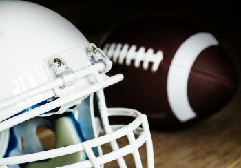 White American Football Helmet and Pigskin Ball