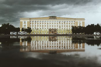 White and Beige Concrete Building Near Water