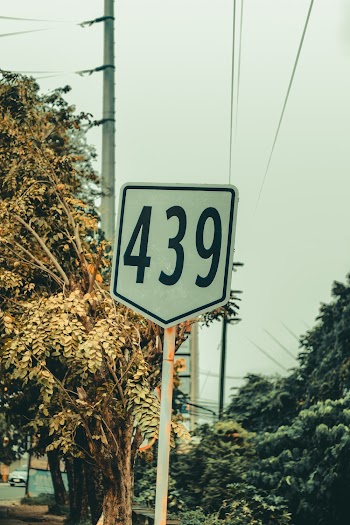 White and Black 439 Road Sign