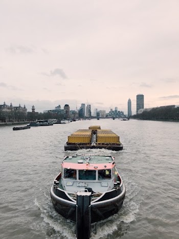 White and Black Boat on Body of Water