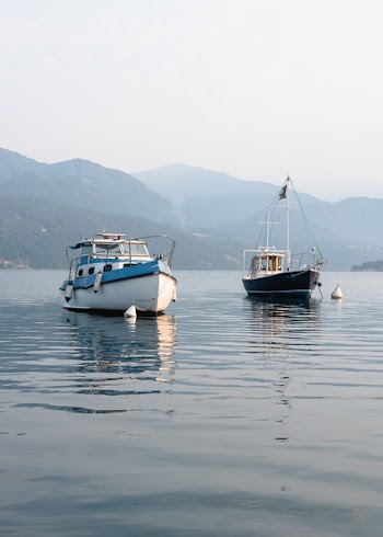 White and Black Boats on Sea