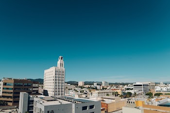 White and Black Concrete Buildings Under Blue Sky