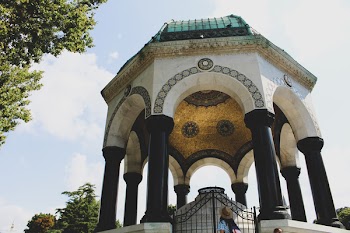 White and Black Concrete Fountain With Gate